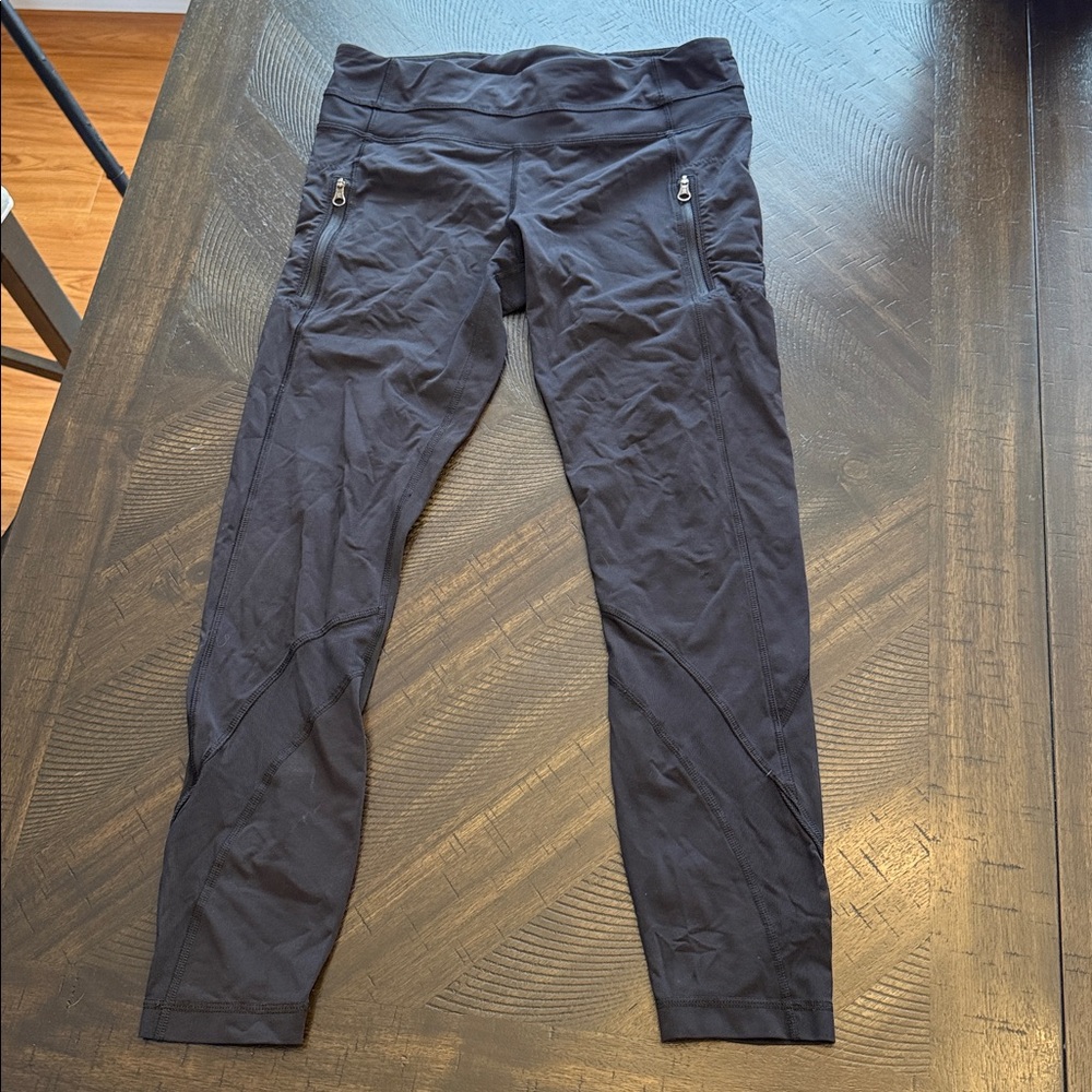 Lululemon 25” Black Leggings with mesh detail & zipper pockets- Size 8